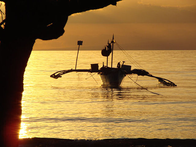 Outriggerboat in the sunset
