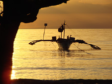 Sunset with local outrigger boat